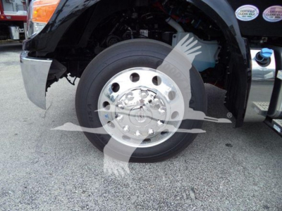 Kenworth T280 front wheel and fender view showing front wheel, chrome hub, and part of step/side panel.