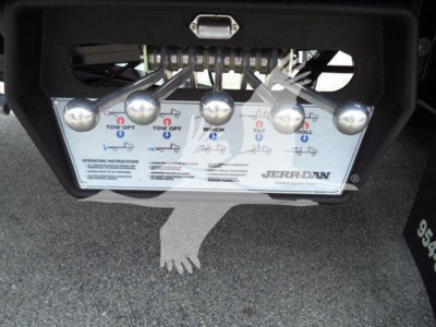Kenworth T280 rollback control panel with five round knobs and instruction diagram, displayed in-bed image. Brand: Jerr-Dan at bottom right.