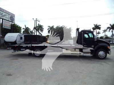 Kenworth T280 rollback truck shown in side profile with a tanker trailer attached.