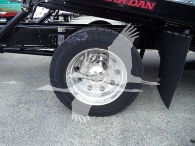 Kenworth T280 rollback truck wheel and chassis showing steel wheel with Black tire and polished hubcap.