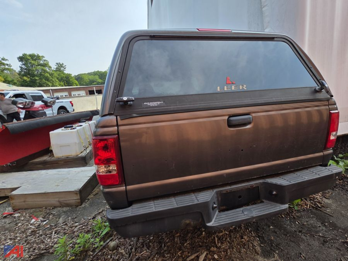 Ford Ranger pickup truck tailgate with cap showing rear view and Leerk brand sticker