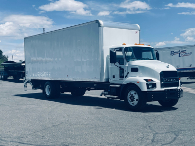 Box truck showing 2026 Mack MD6 in-service with a white cargo box and cab, side profile view