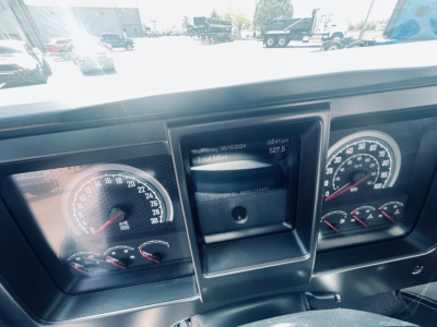 Mack MD6 dashboard view showing instrument cluster with gauges and center display panel.