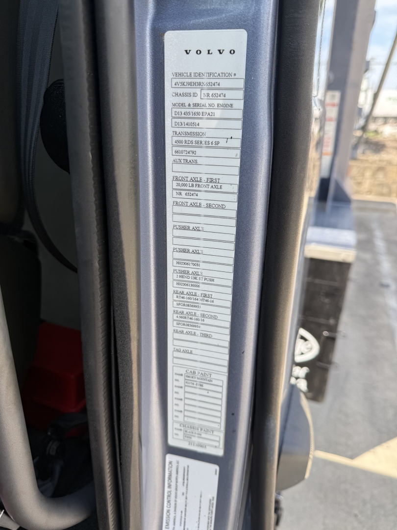Volvo vehicle identification label on door jamb showing model and serial details.