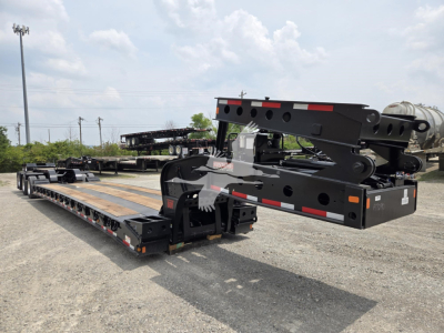 Fontaine 60HD MX lowboy trailer in new condition, extended flatbed with hydraulic gooseneck and heavy-duty frame visible in a lot.