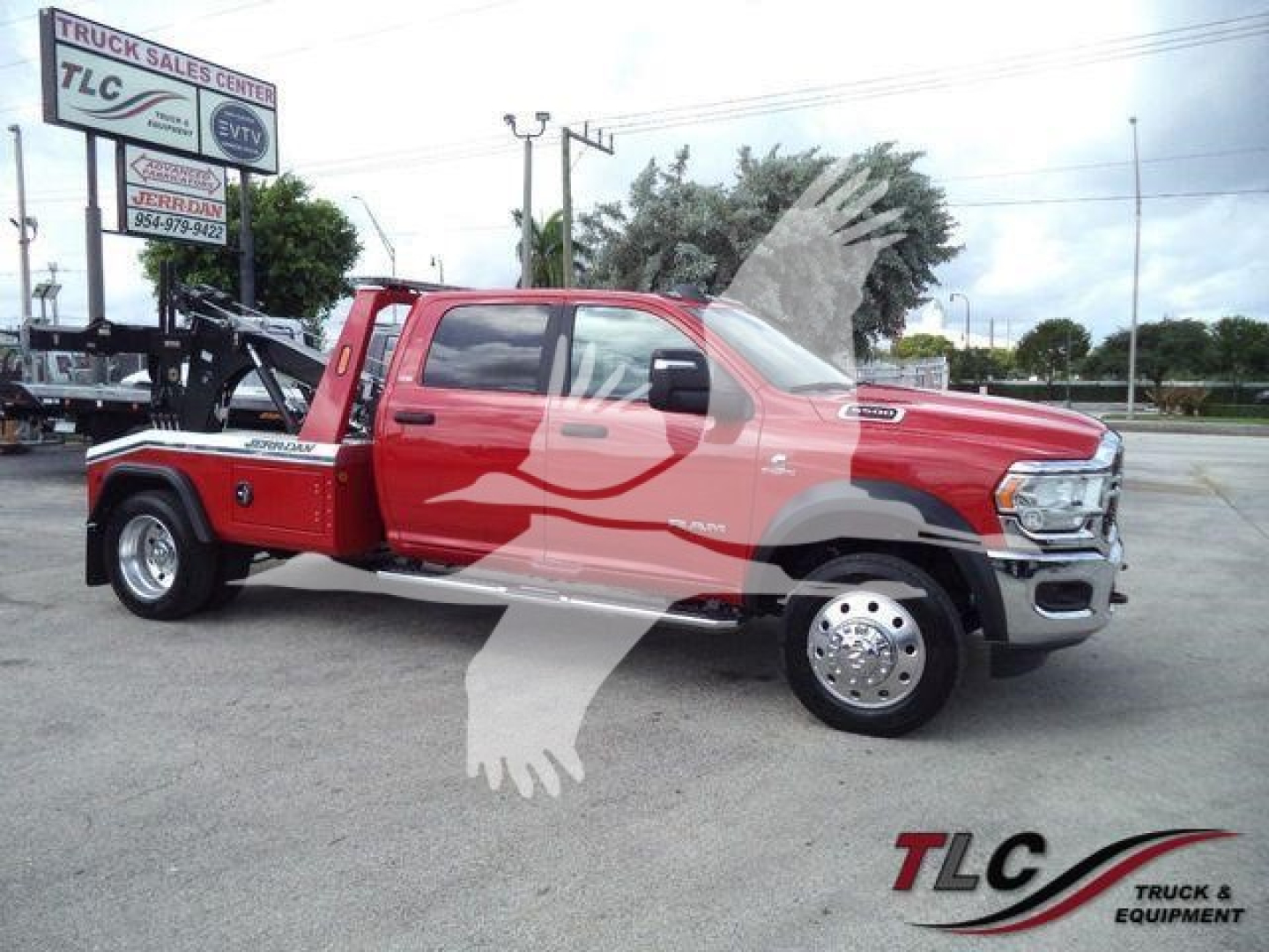 Red Ram 5500 SLT pickup with winch equipment on a dealership lot. Visible text includes TLC Truck Sales sign, MPL40RAM5500RED stock number, and WINCH center label.