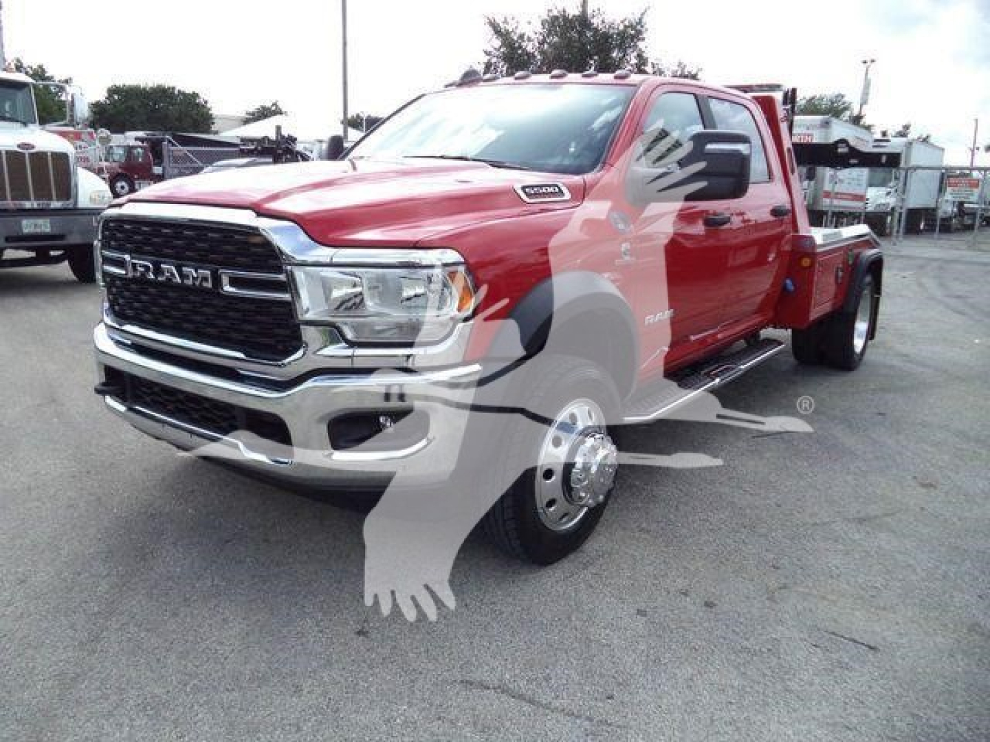 Ram 5500 truck in red, front three-quarter view showing chrome grille, RAM badge, and dual rear wheels; winch category with stock MPL40RAM5500RED.