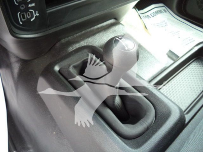 Ram 5500 SLT interior showing manual gear shifter with boot and surrounding center console.