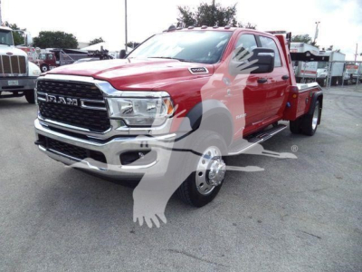 Ram 5500 truck in red, front three-quarter view showing chrome grille, RAM badge, and dual rear wheels; winch category with stock MPL40RAM5500RED.
