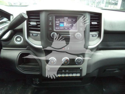 Ram pickup truck dashboard center console showing touchscreen display and climate controls.