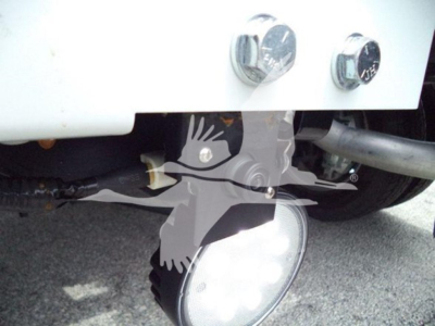 Truck front bumper area showing winch category; partial front wiring and fog light housing visible.