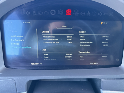 Kenworth T680 dashboard displaying vehicle information: chassis number, engine model, ABS details, software versions, and trip data on the digital screen.
