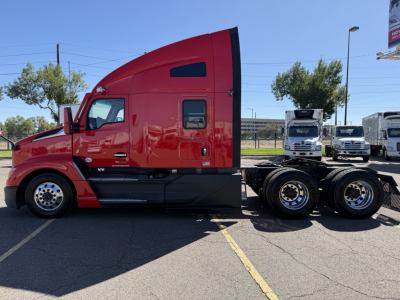 Kenworth T680 truck side view in red with sleeper cab, featuring dual rear axles and chrome wheels.
