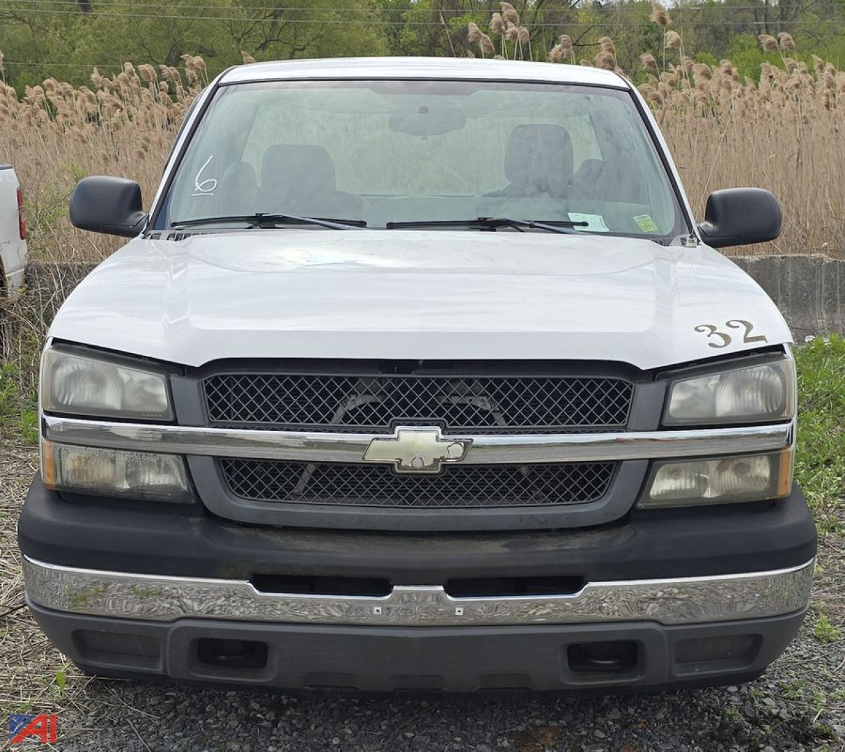 Front view of 2005 Chevrolet Silverado 1500 pickup truck, 2WD, white, with chrome grille and bumper, and black lower trim.