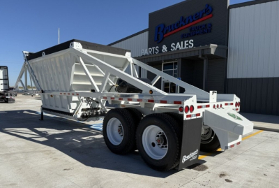 Trailer: Armor Lite SBD40 dump trailer showing dual rear axles and white gravel reclaimer with labeled reflectors.