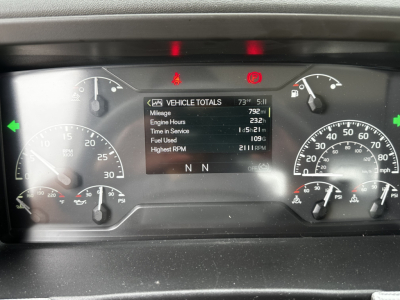 Volvo dash cluster showing vehicle totals with multiple gauges and a central digital display. Readouts include mileage 792mi, engine hours 232h, time in service 1h 52m, fuel used 1099, highest RPM 2118, and N N N on the lower area.