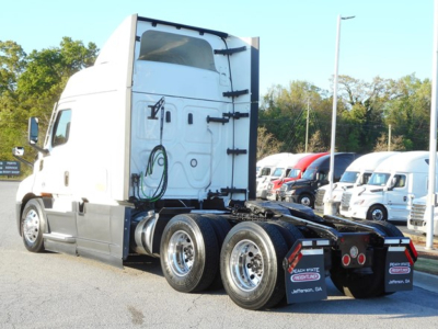 Truck rear/side view of 2022 Freightliner Cascadia 116 sleeper tractor showing fifth-wheel area and dual rear axles