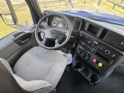 Truck cab interior showing steering wheel, instrument cluster, and center console of a 2020 International LT truck.