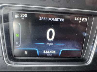 Dashboard speedometer showing 0 mph, N gear indicator, 203 mi fuel/odometer, 533,436 miles total, and 14.1 V on a digital display.