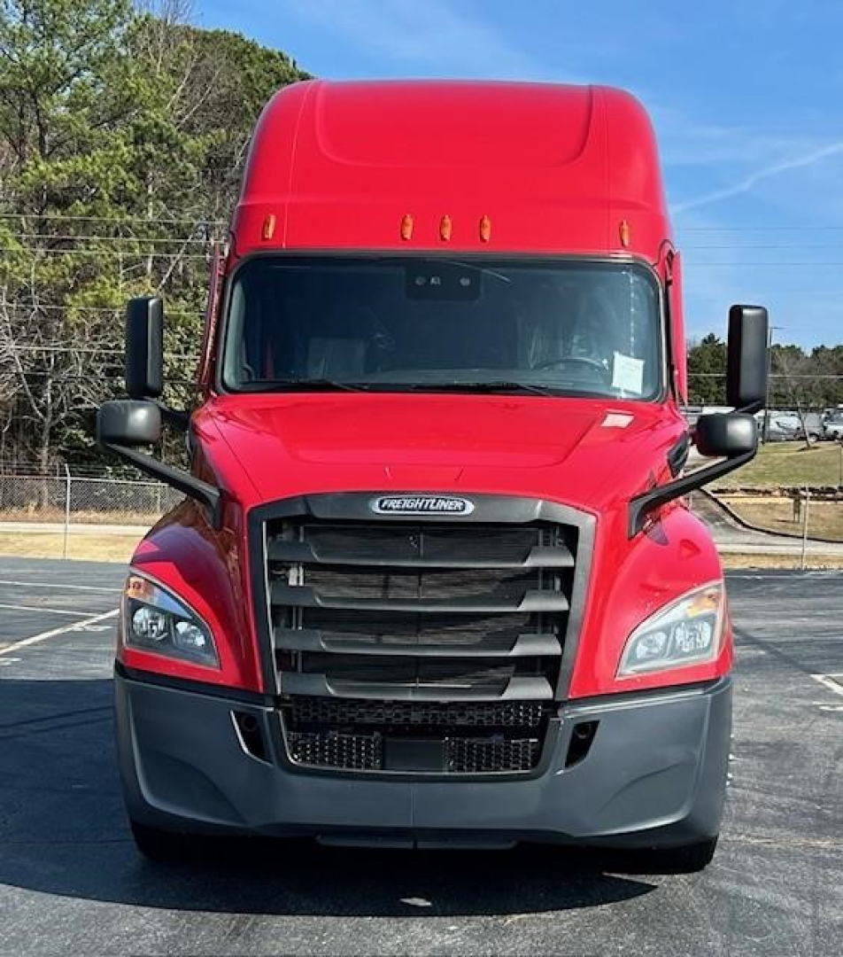 Front view of a red 2022 Freightliner Cascadia 126 conventional sleeper truck with black grille, large bumper, and dual side mirrors.