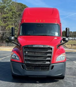 Front view of a red 2022 Freightliner Cascadia 126 conventional sleeper truck with black grille, large bumper, and dual side mirrors.