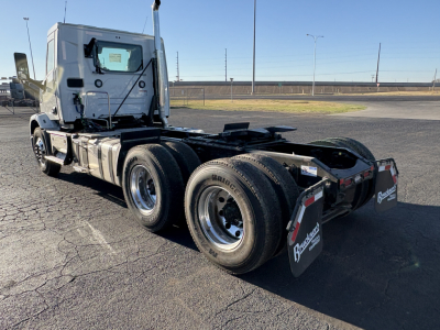 Mack AN64T conventional daycab truck chassis rear view showing dual rear axles and rear mud flaps with Borrelli branding.
