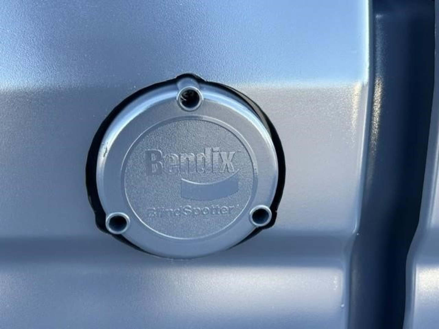 Ridgeline Bendix fuel cap on side of truck tank showing Bendix branding