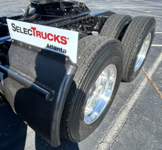 Dual rear axles with tires and chrome rims; sign on mudflap reads SELECTTRUCKS Atlanta.