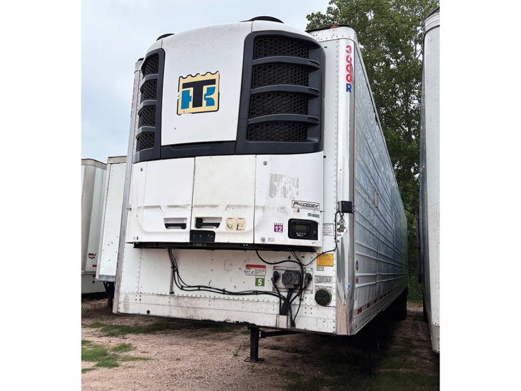 TT Transport refrigerated trailer nose showing Thermo King unit and front landing gear