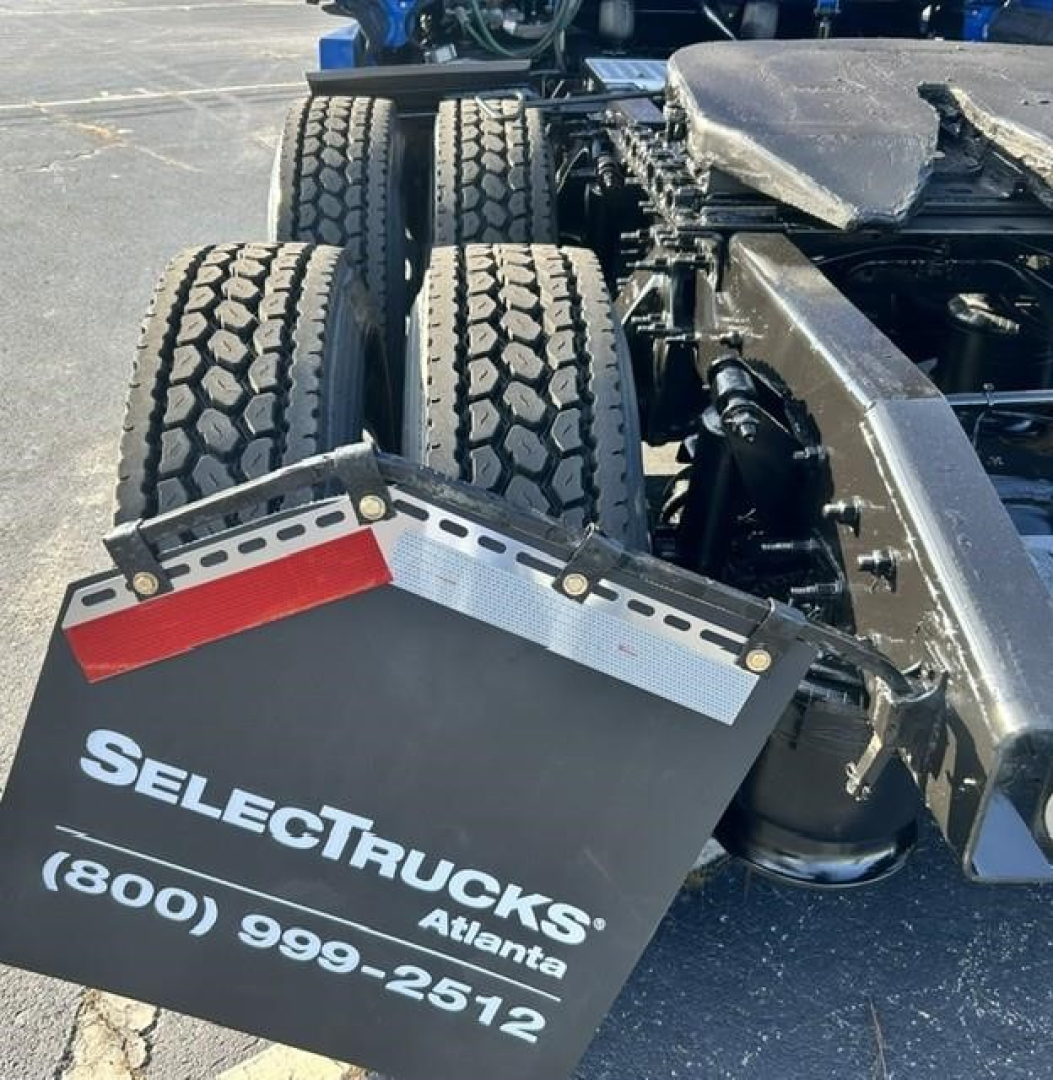 Rear view showing dual rear axles and mudflaps with SELECTRUCKS Atlanta phone number.