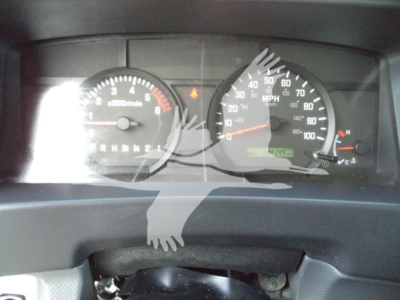 Isuzu NPR dashboard view showing speedometer up to 100 mph and tachometer, with odometer and warning lights visible.