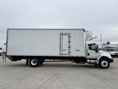 Truck cab and refrigerated box on International MV607 with side load door and refrigeration unit.