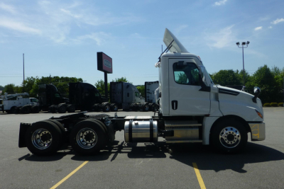 Freightliner Cascadia 126 day cab truck side profile showing chassis, wheels, and cab; no trailer attached.