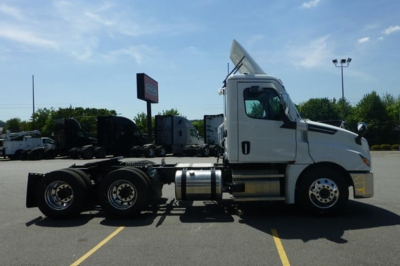 Freightliner Cascadia 126 day cab truck side profile showing chassis and cab with fuel tanks