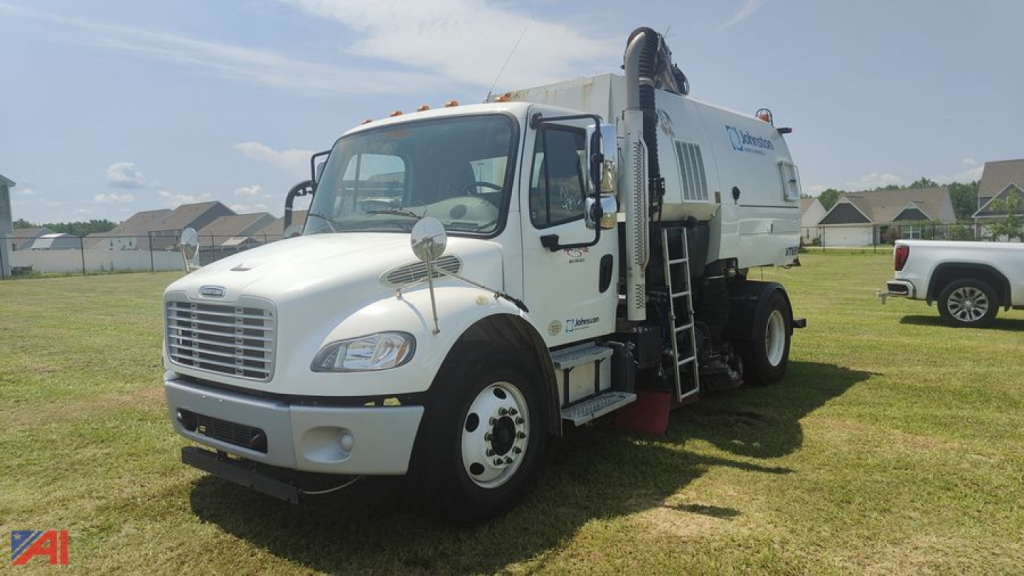Sweeper/Vac truck from a 2014 Freightliner M2 106, side view showing rear mounted waste vacuum body, side ladder, and wheels.