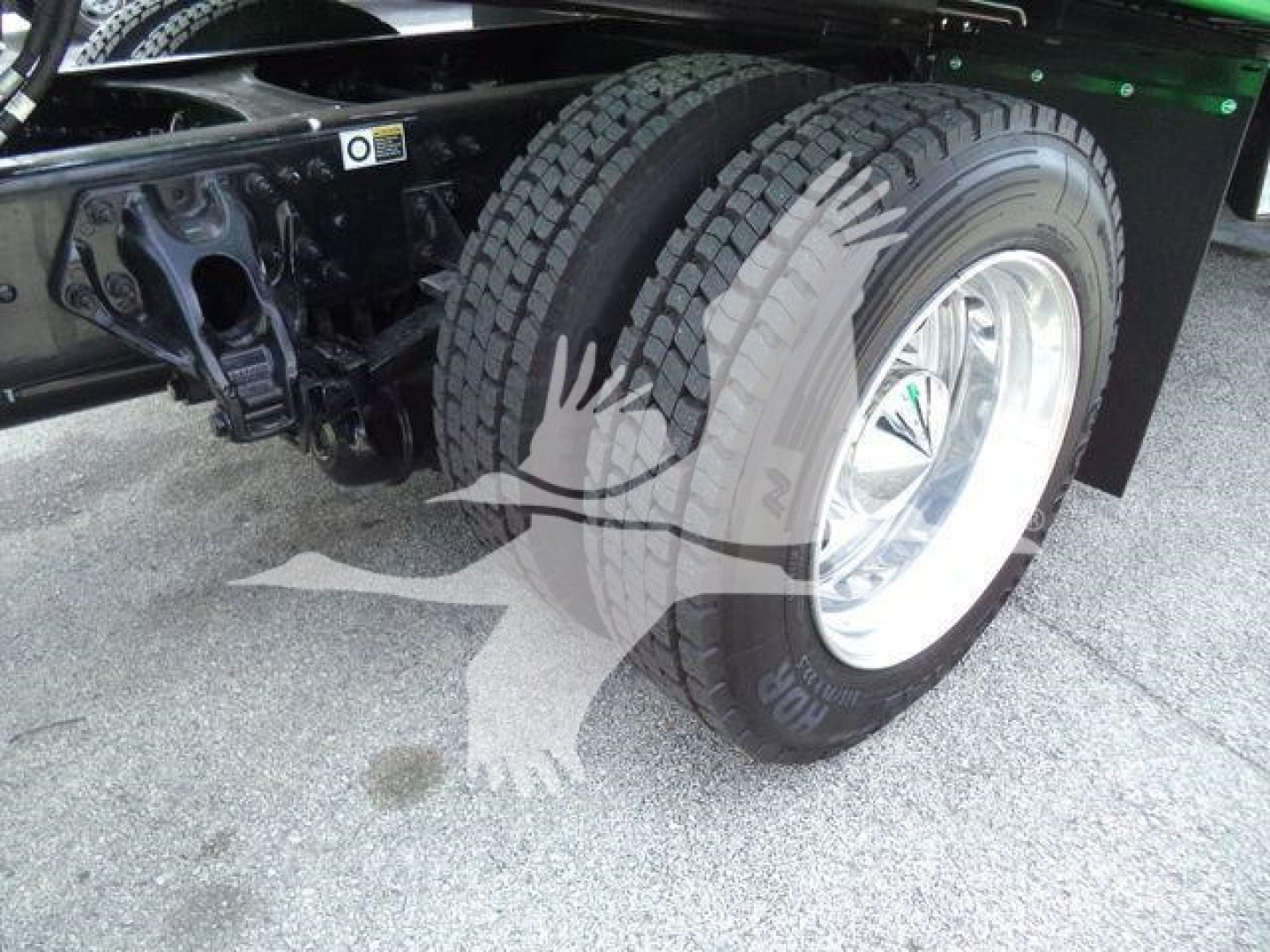 Peterbilt 536 rollback truck rear wheel and chassis view showing dual rear tires and wheel hub.