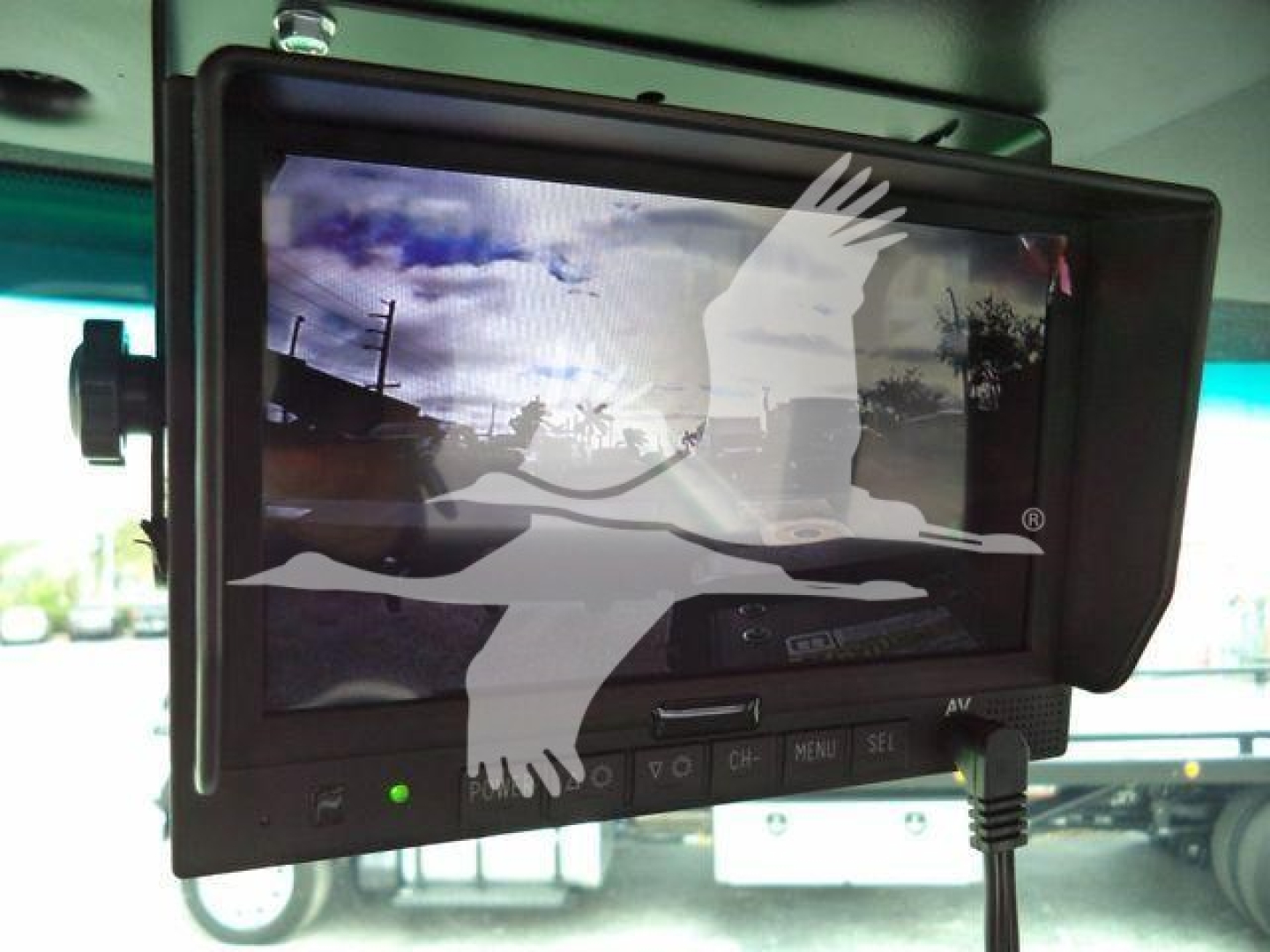 Peterbilt 536 rollback truck interior monitor screen displaying rear camera feed and controls.