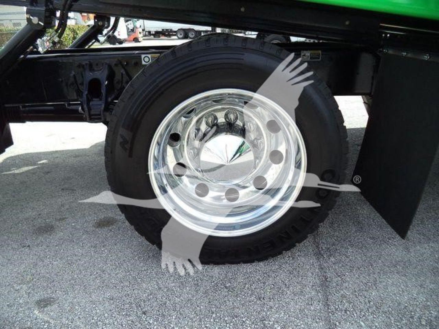 Peterbilt 536 rollback truck wheel and chrome hub showing tire and fender area.