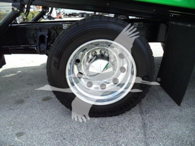 Peterbilt 536 rollback truck wheel and chrome hub showing tire and fender area.