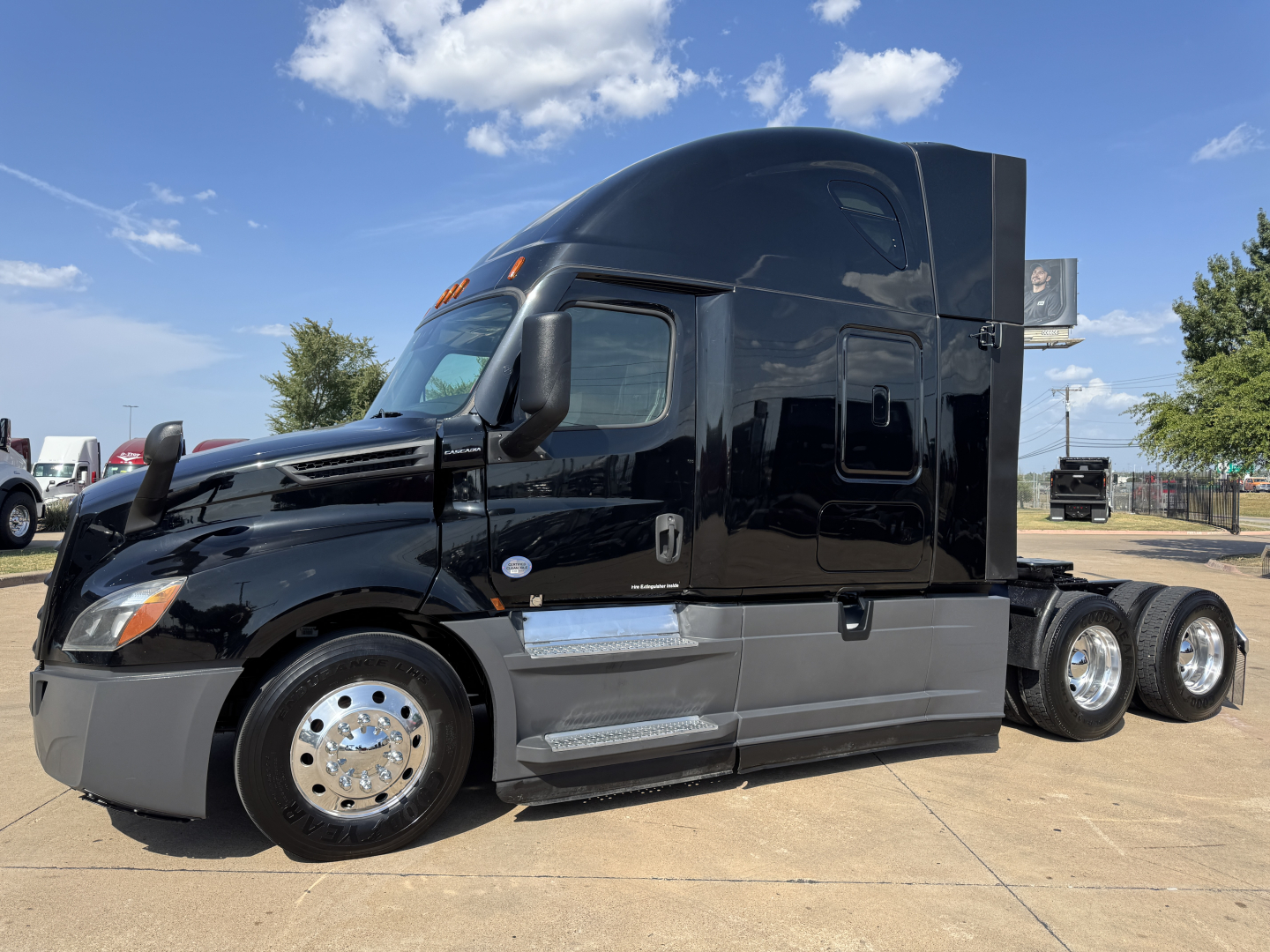 Conventional sleeper truck 2020 Freightliner PT126064ST, black cab with chrome wheels, dual rear axles, side steps, VIN partially visible, stock number 0628830.