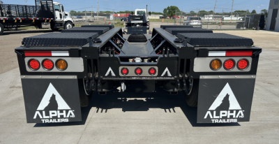 Alpha Trailers A110HDG 18 LDH lowboy trailer rear view showing taillights, mud flaps with Alpha Trailers logo, and mid-section hitch area.