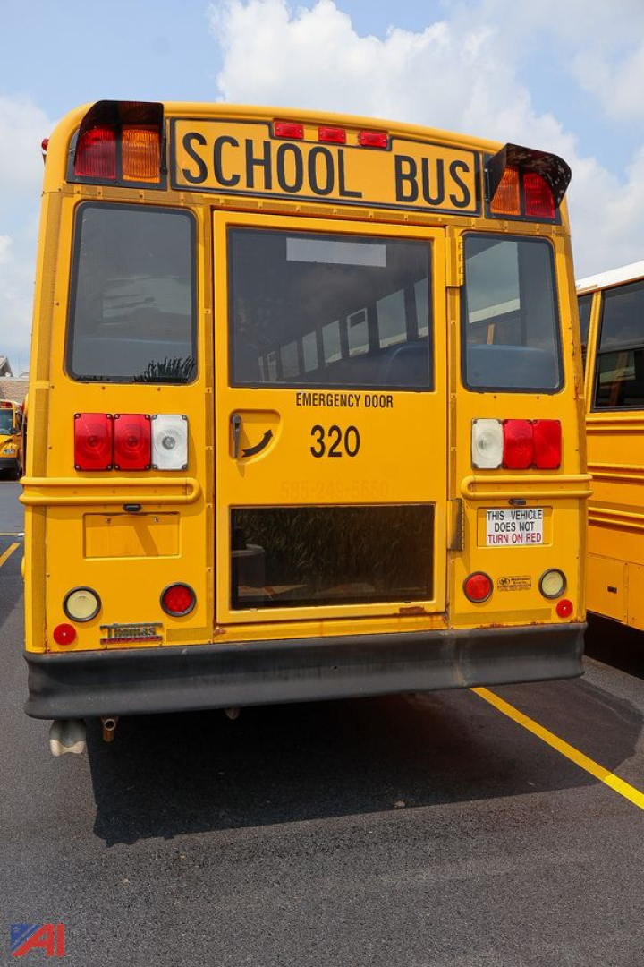 Rear view of a yellow school bus showing emergency exit door,