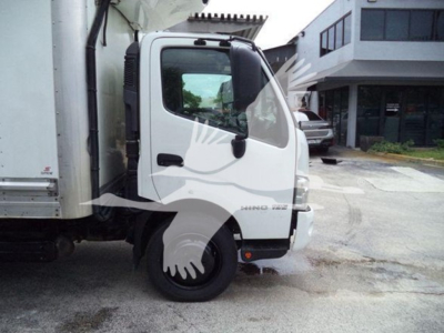 [Vehicle] 2020 Hino 195 refrigerated truck cab side with front wheel visible and cab door text readable.
