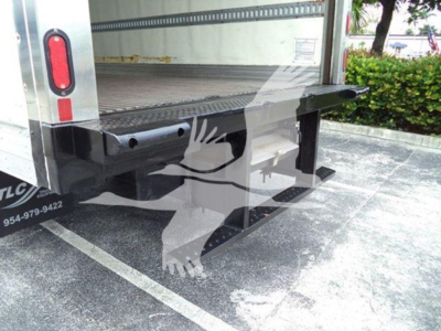 Rear view of a 2020 Hino 195 refrigerated truck showing loading area and rear undercarriage with a Metal bumper step and reflective taillights.