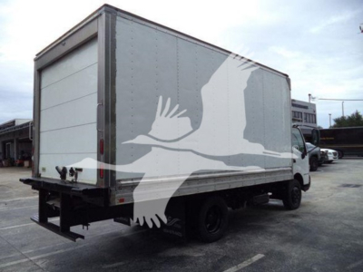 Truck rear and side view of a 2020 Hino 195 refrigerated box truck with stock number T04086 and VIN JHHHDM2H0LK004086