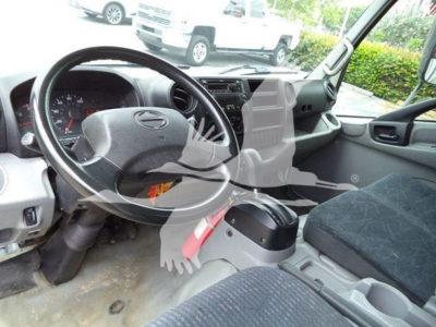 Interior cab view of 2020 Hino 195 refrigerated truck showing steering wheel, dashboard, center console, and driver seat.