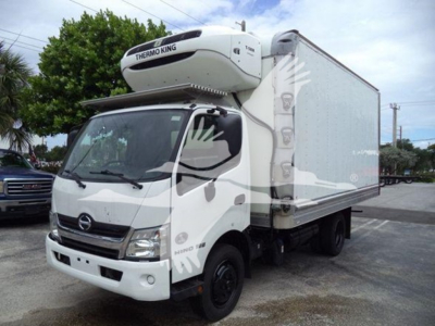 Hino 195 refrigerated box truck with Thermo King unit on top, white cab, side cargo box, parked outdoors.