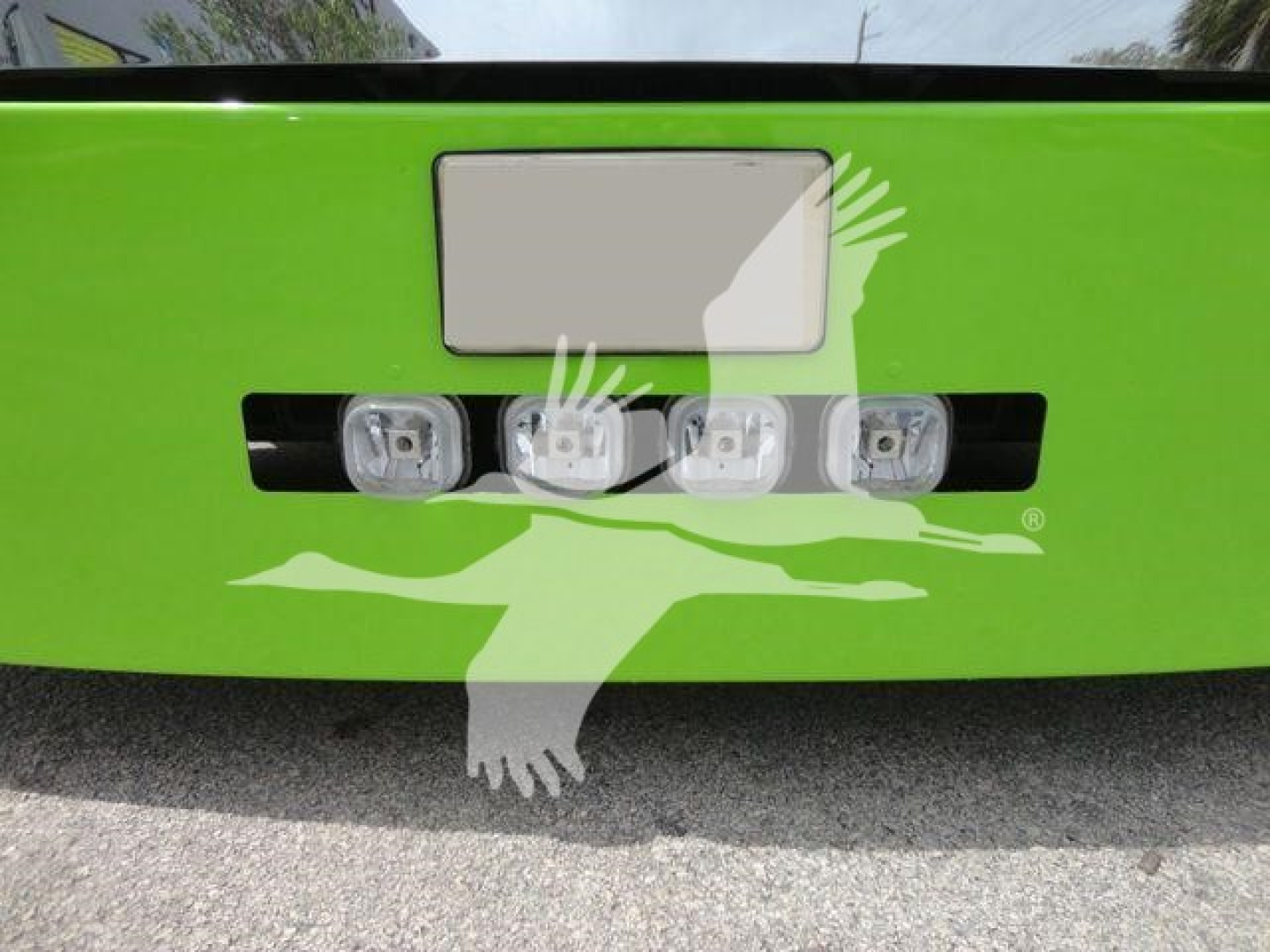 Peterbilt 337 rear bumper with four LED backup lights on a bright green truck, license plate area above, stock number 2020STEPSIDE in listing.
