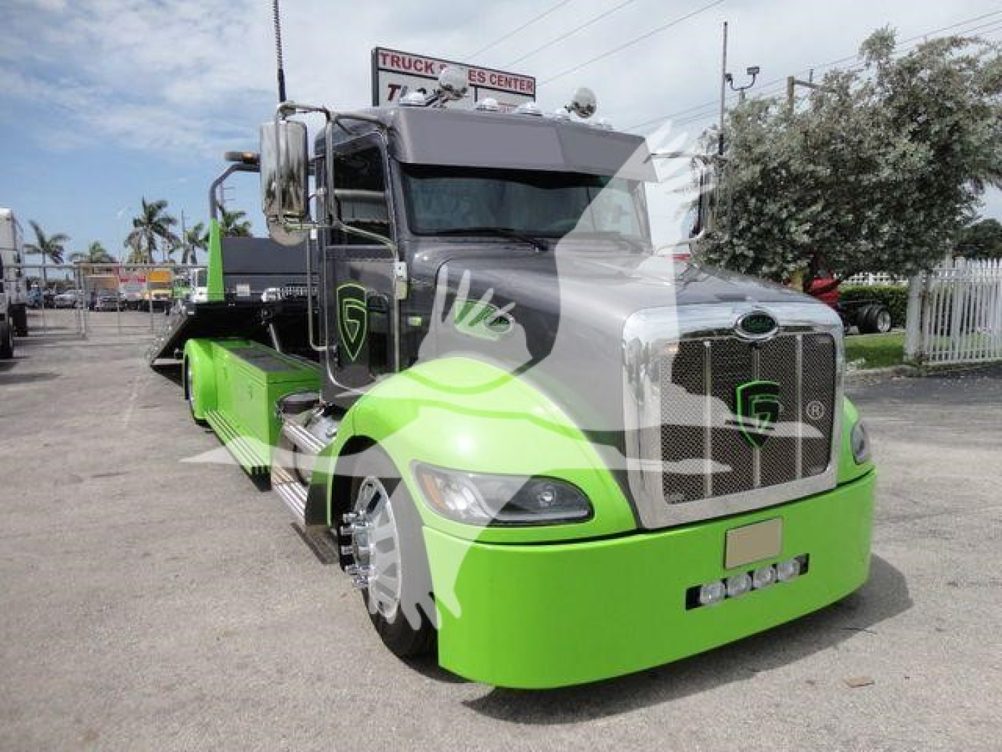 2020 Peterbilt 337 rollback truck color green and black front view showing chrome grille and headlamps
