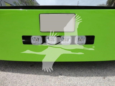 Peterbilt 337 rear bumper with four LED backup lights on a bright green truck, license plate area above, stock number 2020STEPSIDE in listing.